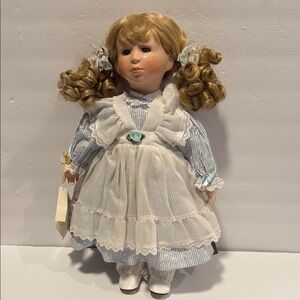 Adorable Doll with Blonde Curls and White Dress